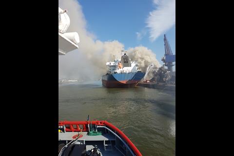 The tugs shifted a bulk carrier moored at the facility to a safe berthing place away from the blaze